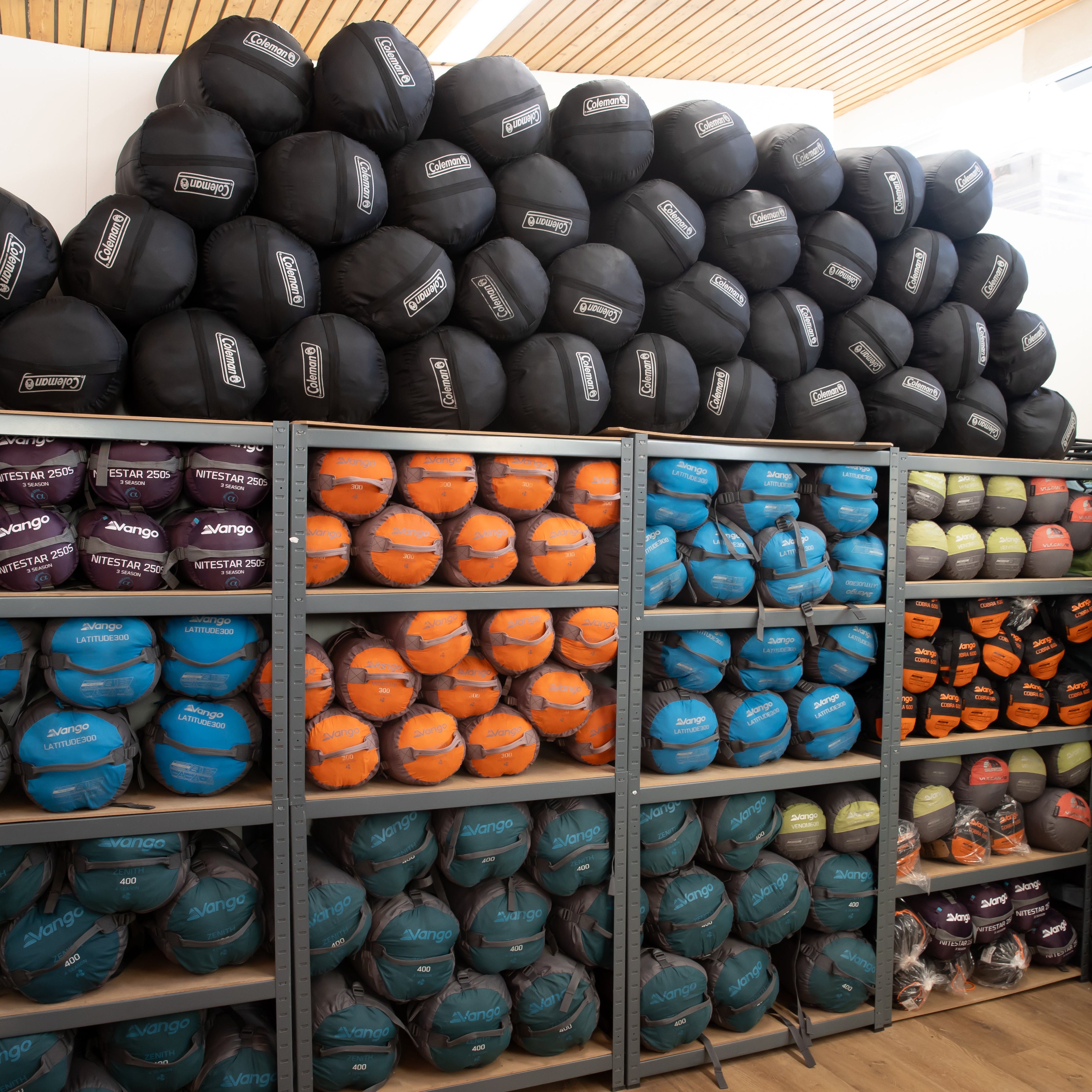 Storage room with shelves filled with colorful balls and bags.